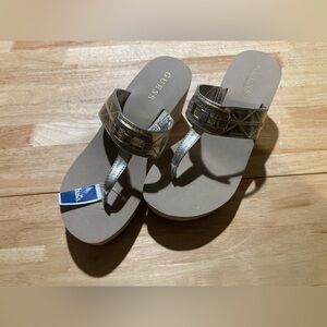 Guess platform sandals in size 8M in a gold type color.NWT. Faux buckle look